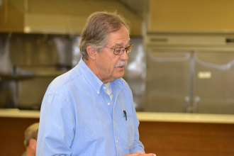 Longtime Kings County resident Jerry Irons asks candidates a question.